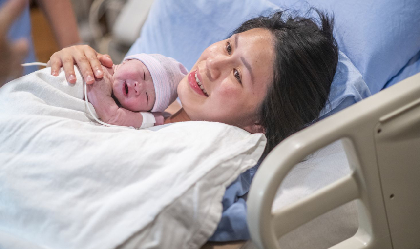Woman holding her newborn baby