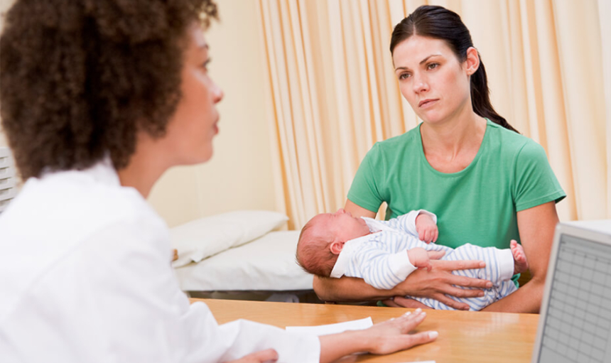 Postnatal Support Woman holding baby and getting doula services